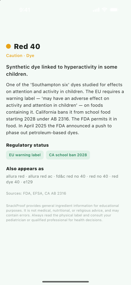SnackProof's Red 40 ingredient card showing the Caution label, regulatory chips for the EU warning label and the California school ban, and its alternative names